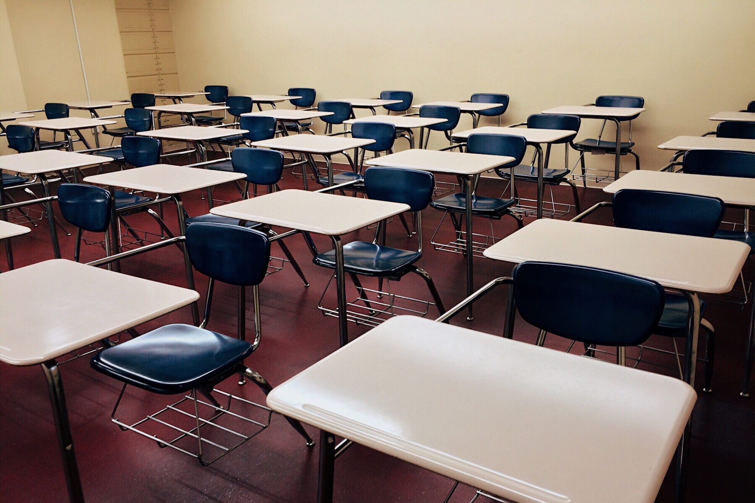 Image of a school classroom full of desks